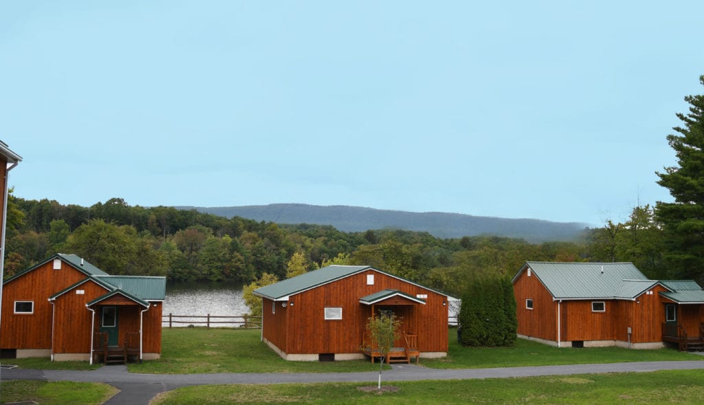 Rustic camp cabins nestled along the lakeshore