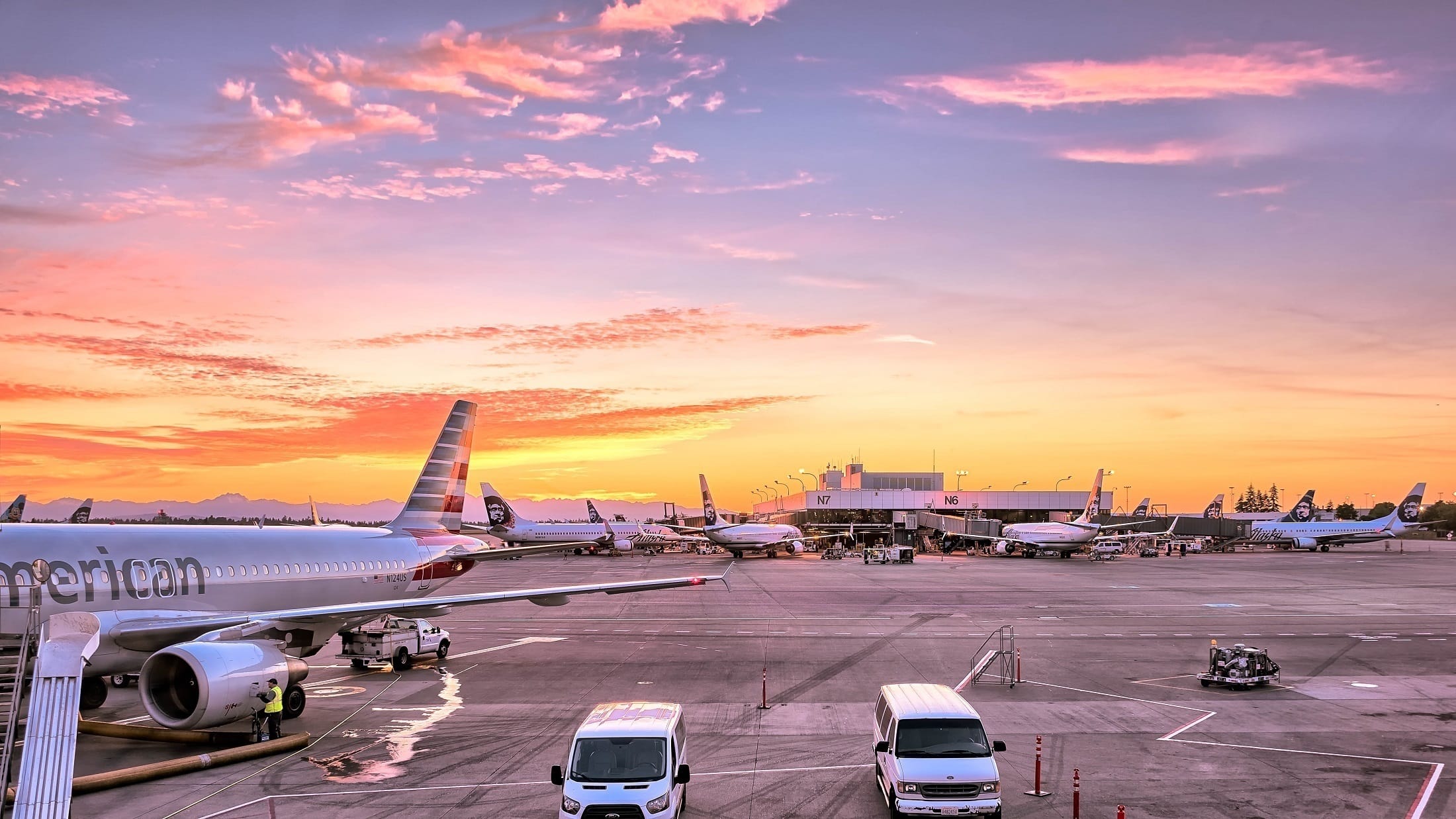 Airport at sunset, representing international travel to summer camp