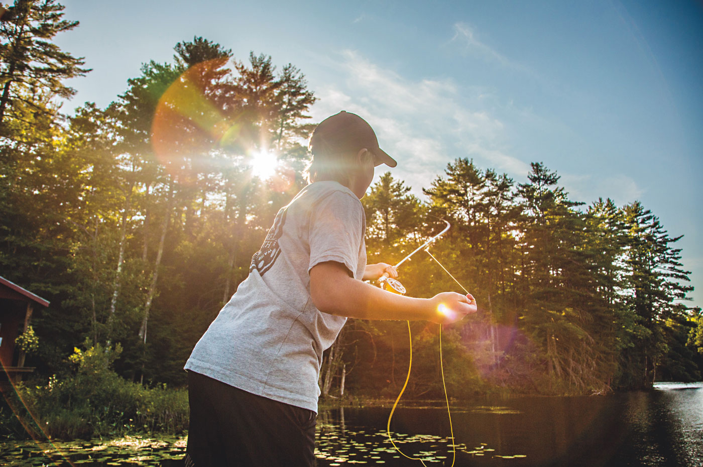 A counselor and camper share a golden-hour moment at camp, reflecting the leadership growth of a CIT program