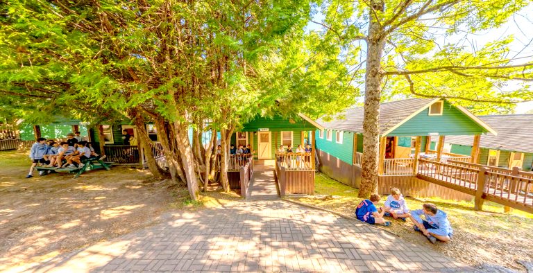 Cabins at camp surrounded by trees