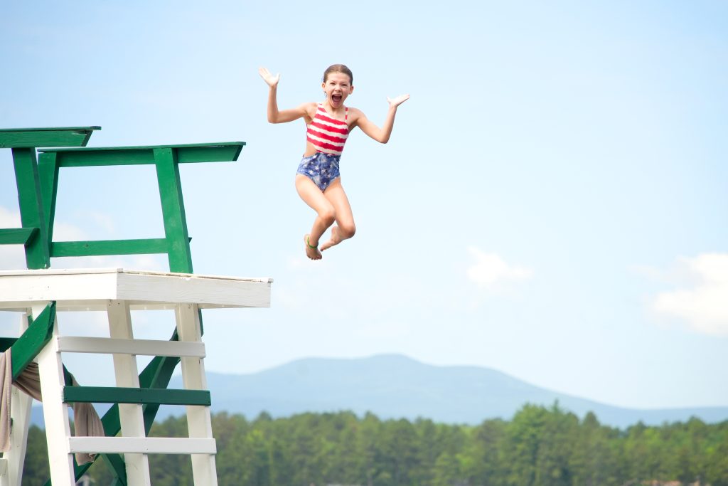 girl jumps off pier at camp robin hood